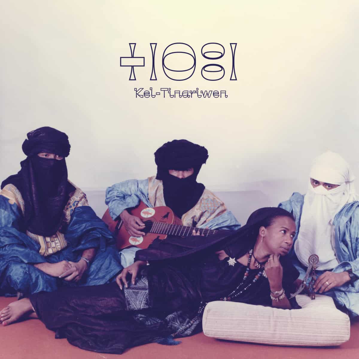 Tinariwen - Kel Tinariwen Vinyl Record
Album cover with four musicians sitting on a couch, playing instruments, with 'Hios' and 'Kel-Tnartwen' text above.