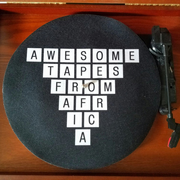 A turntable slipmat with the logo - Awesome tapes From Africa