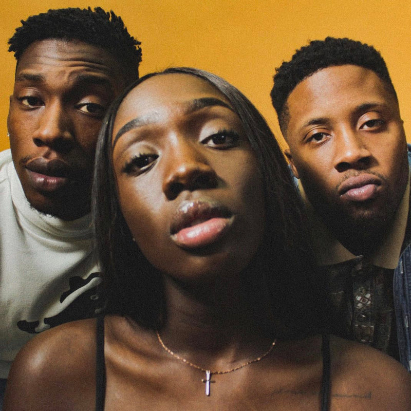 three people looking at the camera
