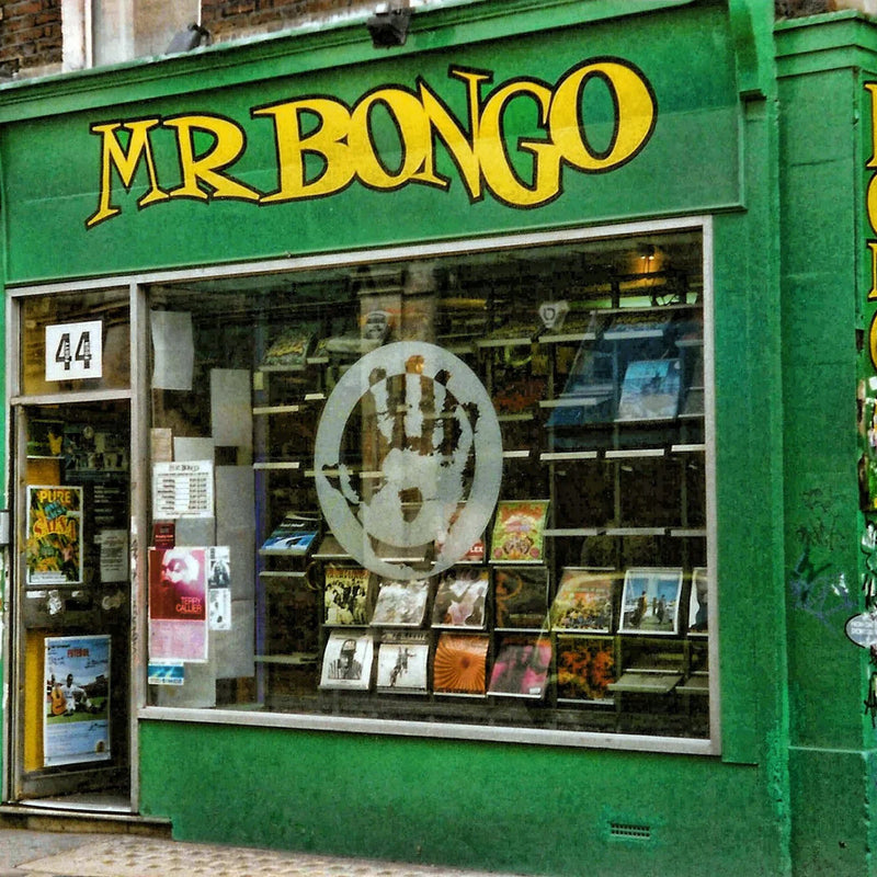 A vibrant green storefront of "MR BONGO" music shop with vinyl records on display.