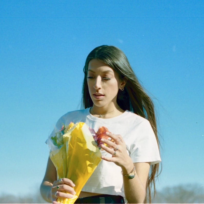 A woman holding a bouqet of flowers