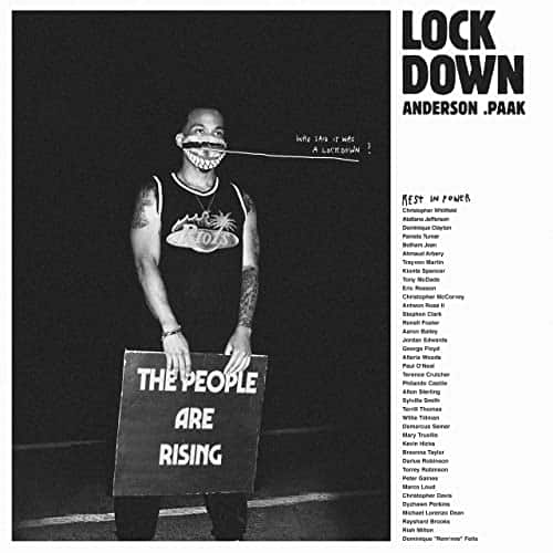 A person holding a protest sign, "THE PEOPLE ARE RISING," on a black and white album cover.
