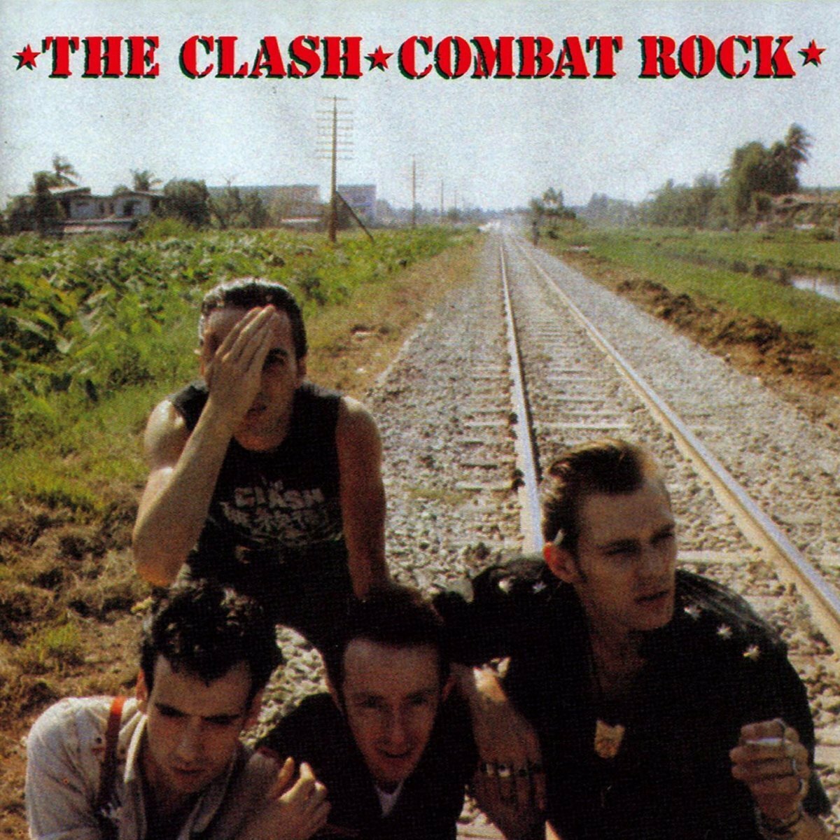 Clash - Combat Rock (1LP/180G/GREEN/POSTER) Vinyl Record

Album cover of 'Combat Rock' by The Clash with four band members on railway tracks.