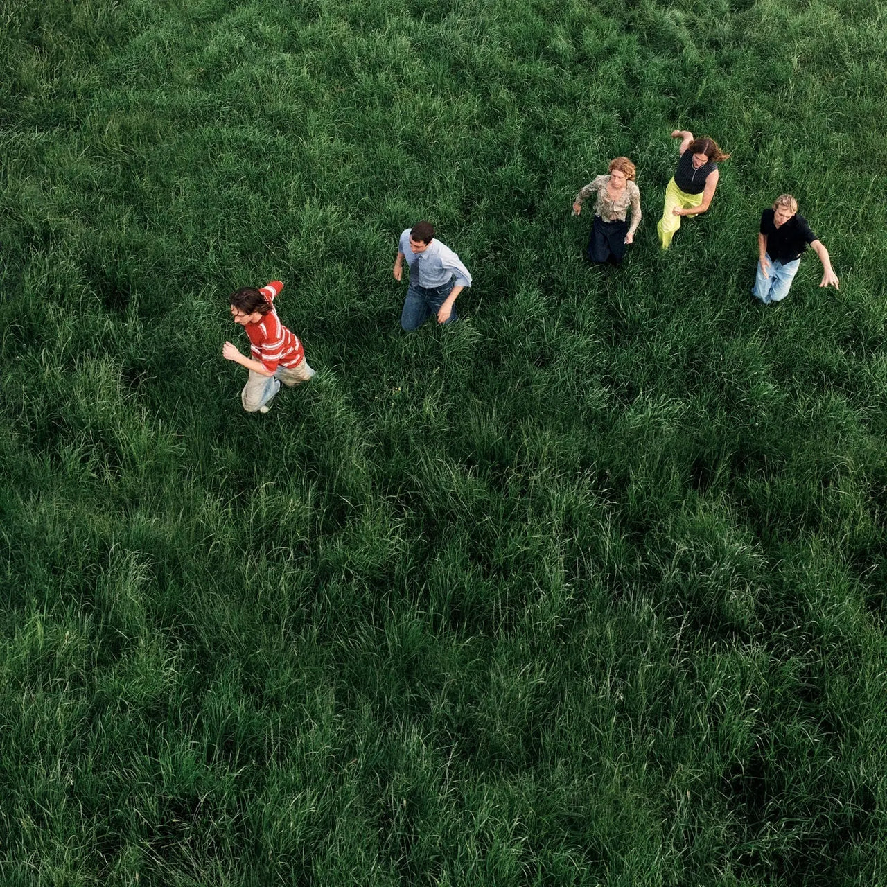 Parcels - Loved Vinyl Record

A group of people standing in a grassy field from an aerial perspective