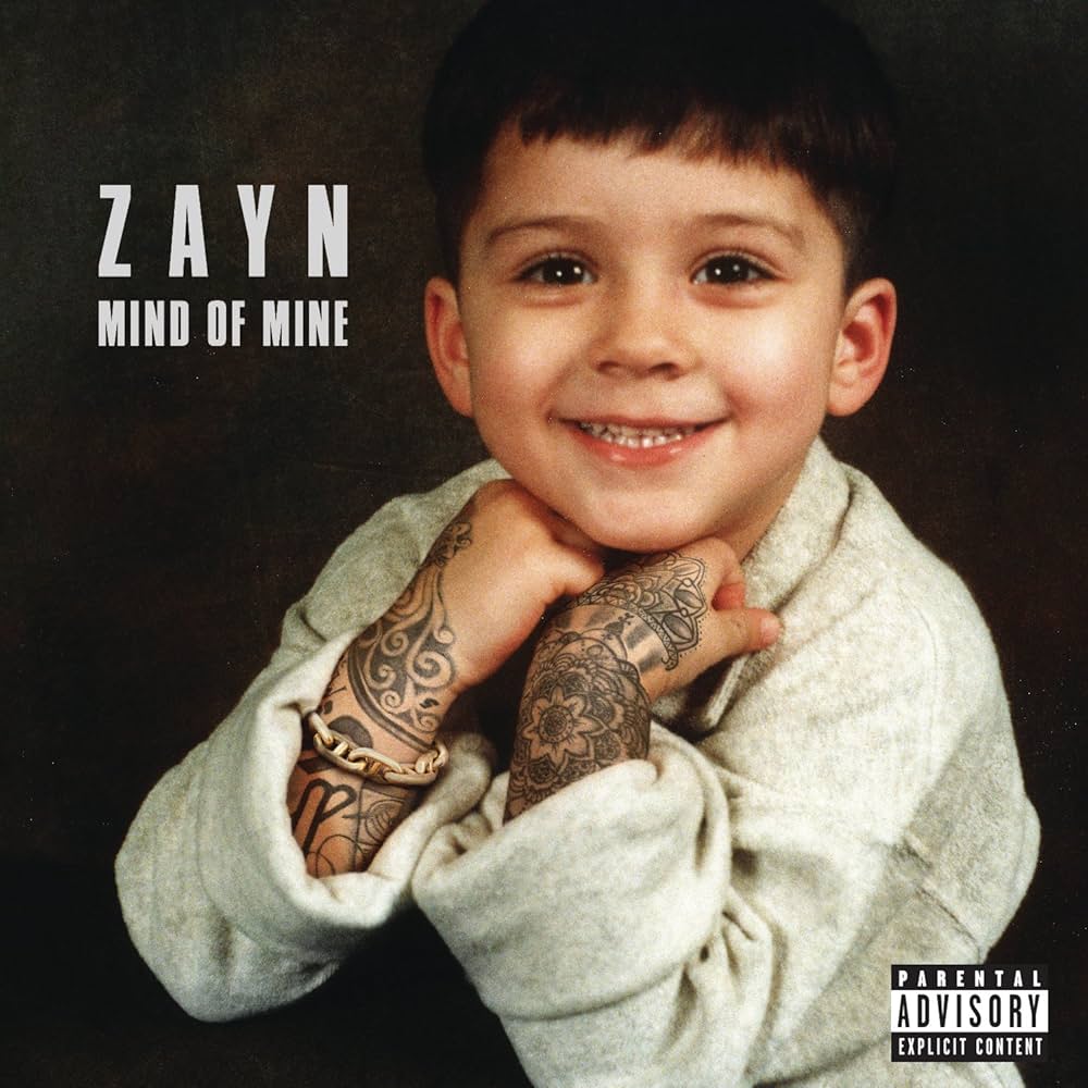 ZAYN - Mind Of Mine Vinyl Record

Album cover with a child holding tattooed arms, featuring the text 'ZAYN Mind of Mine' and a parental advisory label.