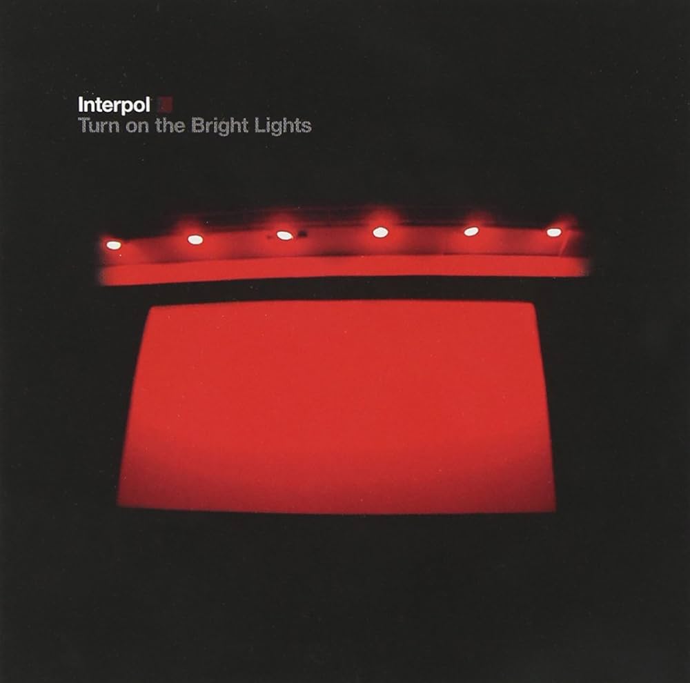 An image of the album Interpol-Turn On The Bright Lights