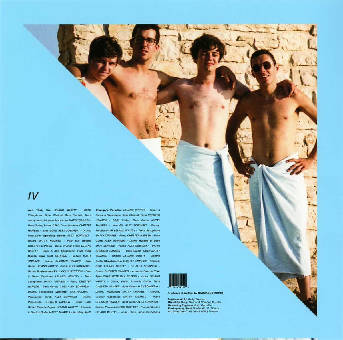 A magazine cover featuring four men wrapped in towels